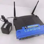 The Linksys WRT54G v6 router with 54mbps WiFi, 4 100mbps ETH-ports and
                                                 0 USB-ports