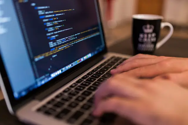 A man typing a command code