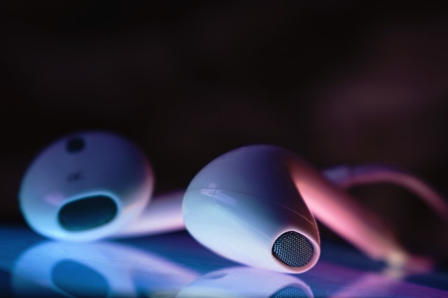 A pair of white earbuds