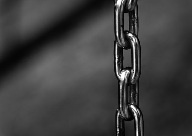 A metal chain hangs around the surface