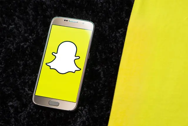 a phone with snapchat logo