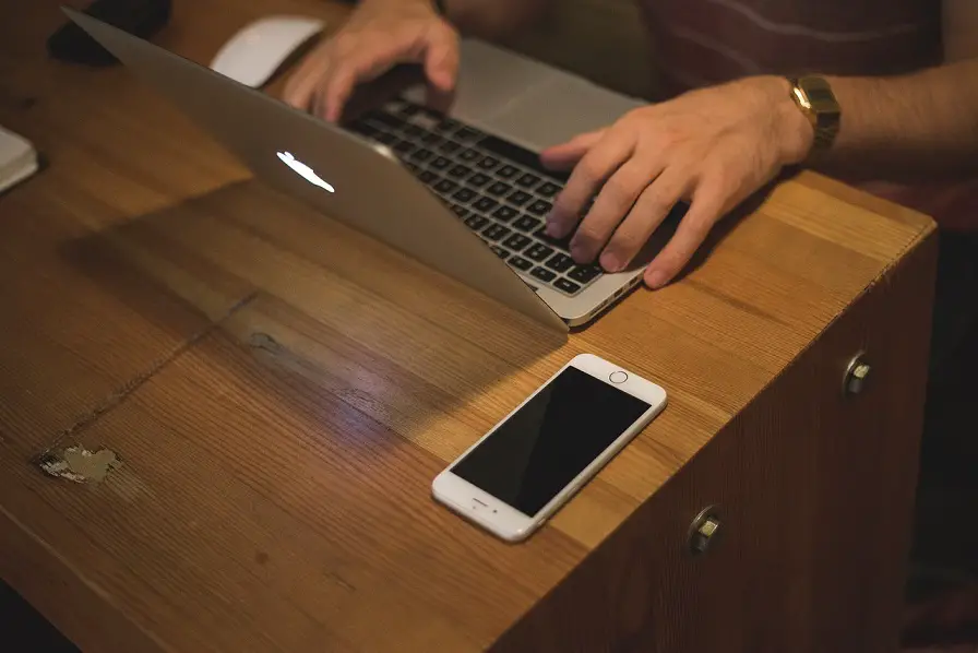 A man using his laptop.